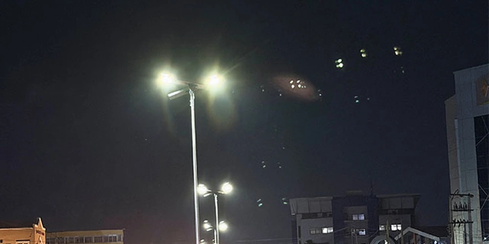 Delivered municipal solar street lighting project illuminating a city road at night