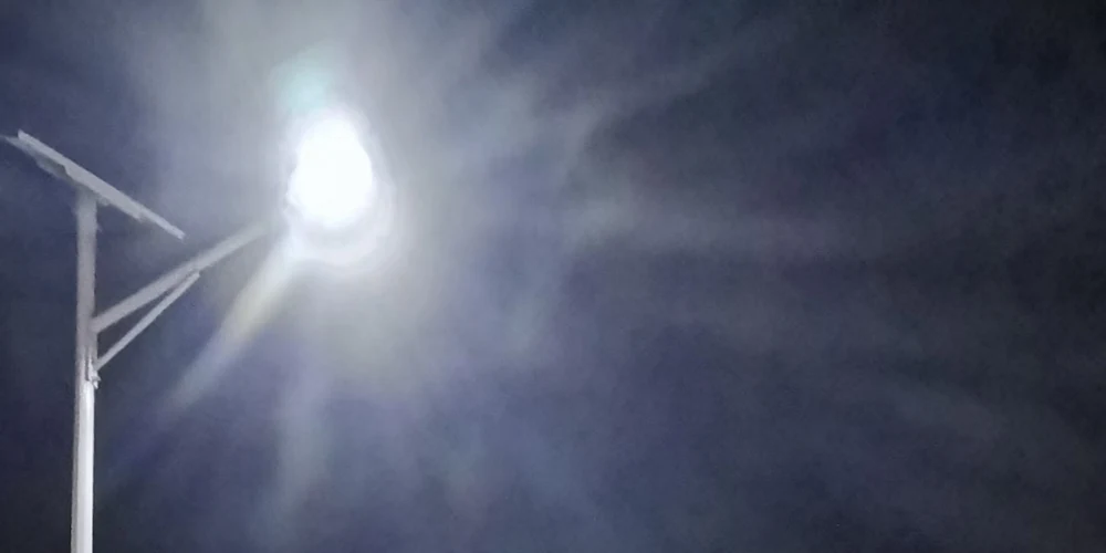 Solar street lights continuing to operate through the night on a rural township road