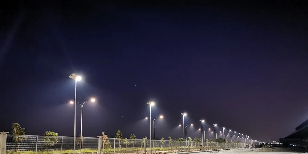 RoadSmart FH120 solar street lights illuminating an industrial park road in Malaysia