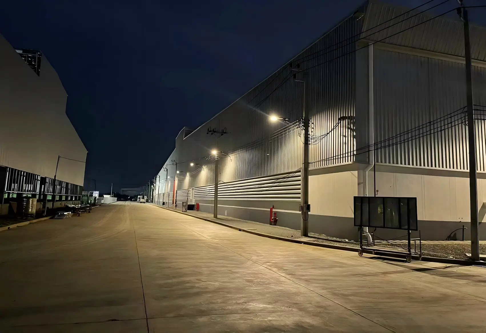 Logistics Center with Trucks and 24-Hour Operation.webp